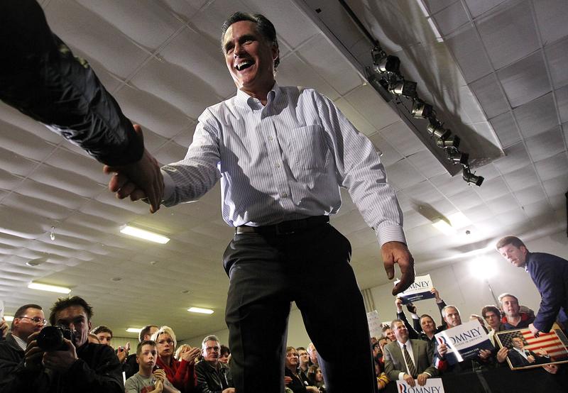 Republican presidential hopeful former Massachusetts Gov. Mitt Romney greets supporters during a campaign rally on January 9, 2012 in Bedford, New Hampshire.